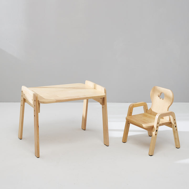 a wooden table and chair sitting next to each other