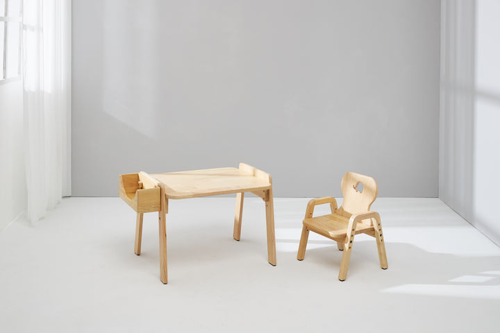 a wooden table and a wooden chair in a room