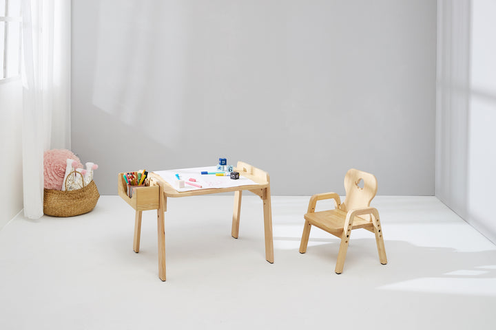 a small wooden table and chair in a room