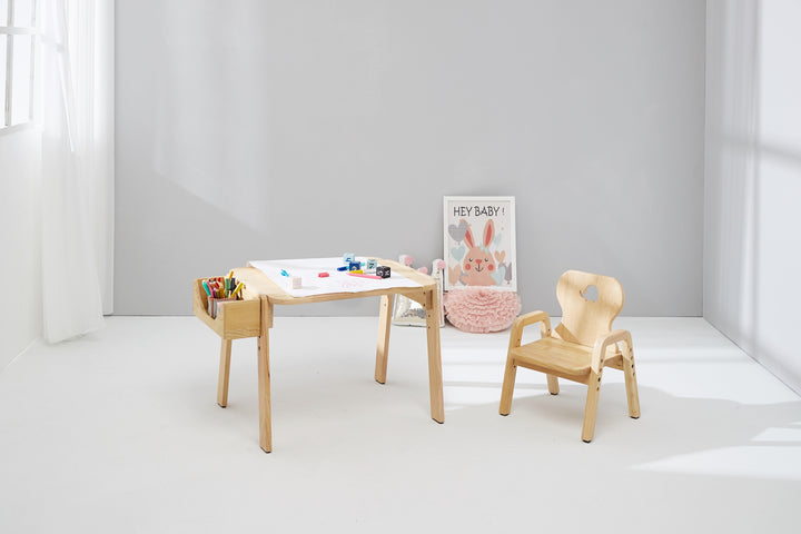 two wooden chairs and a table in a room