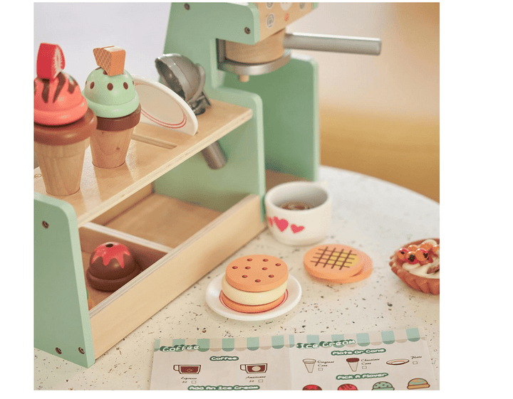 a table topped with a cup of coffee and cookies