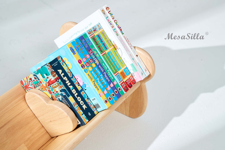 a wooden bench holding a stack of books