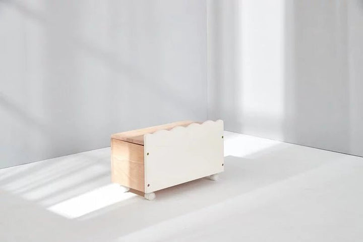 a wooden box sitting on top of a white floor