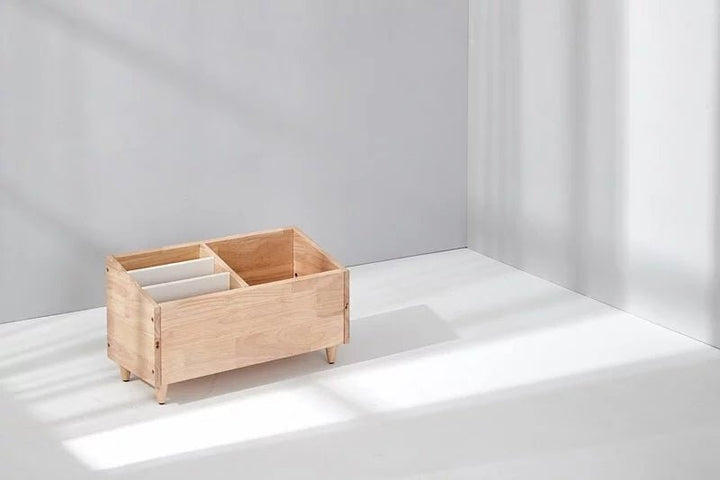 a wooden box sitting on top of a white floor