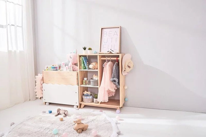 a baby's room with a white rug and a wooden cabinet