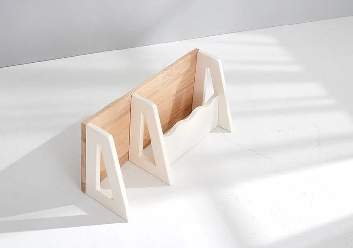 a wooden object sitting on top of a white table