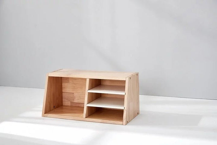 a wooden shelf sitting on top of a white floor