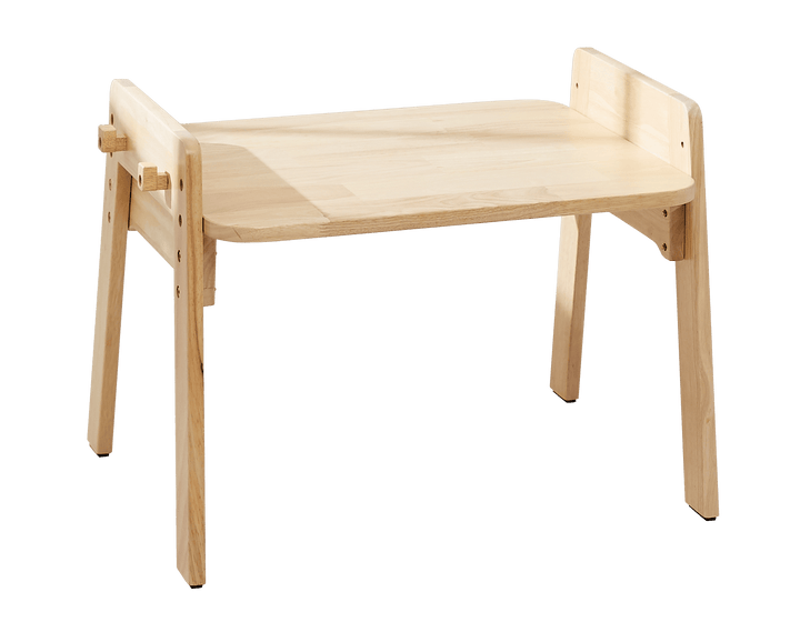 a wooden table with a chair on top of it