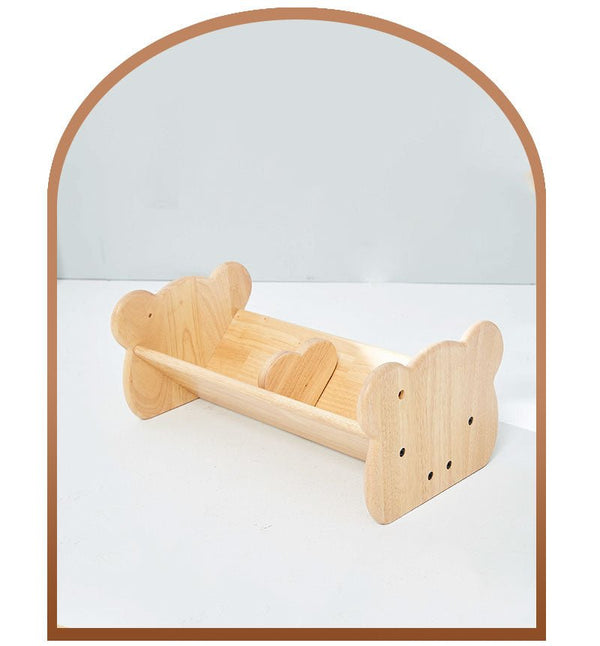 a wooden toy boat with a wooden handle