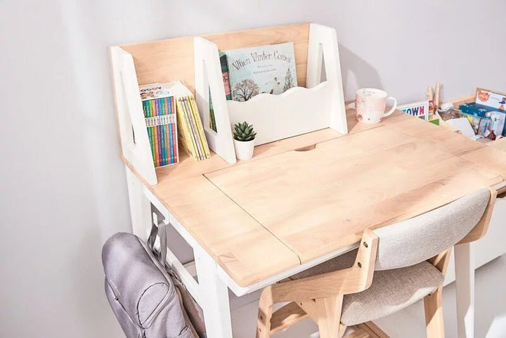 a child's desk with a chair and a book shelf