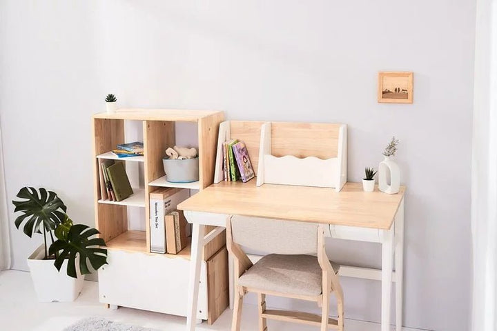 a desk with a chair and a shelf with books