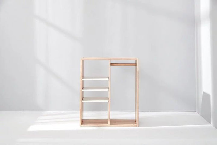 a white room with a shelf and a window