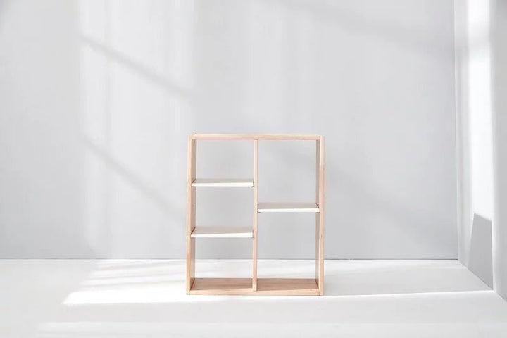 a white room with a shelf and a window