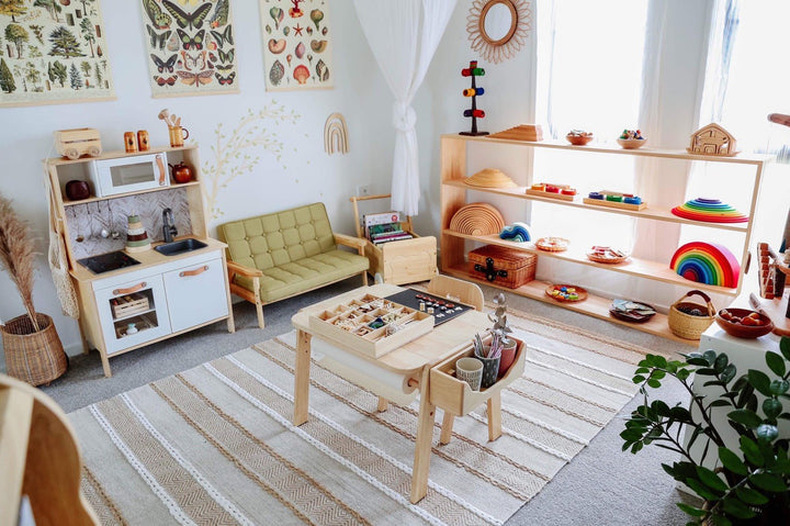 a child's playroom with a table and chairs